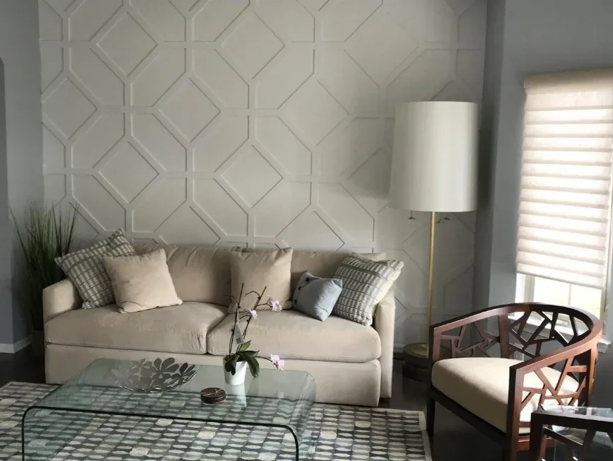 A living room with a grey couch and a coffee table.
