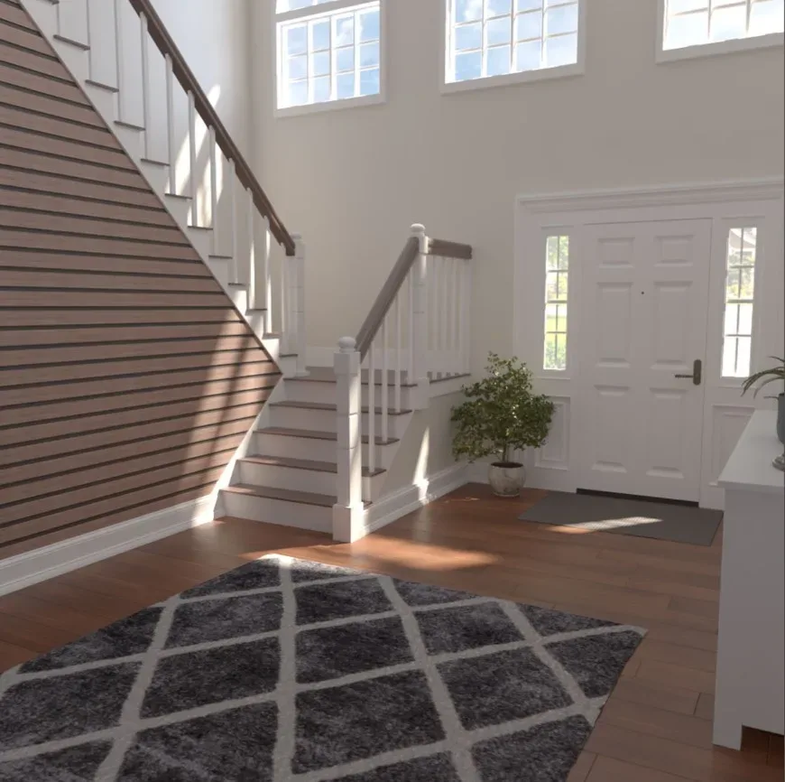 A 3d rendering of a home with stairs and a rug.