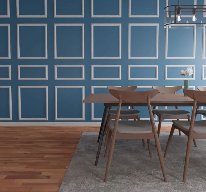 A dining room with blue walls and wooden floors.